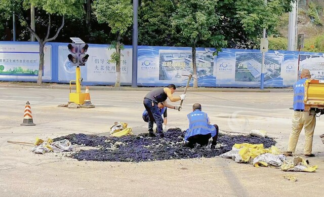 富兴路——源丰街临时红绿灯交汇处路面修补 (2).jpg
